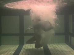 Brunette teen Kristina Andreeva swims naked in the pool Thumb