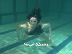 Dressed up teen Irina Barna swims sexy in the pool Thumb