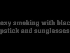 Sexy smoking with black lipstick and sunglasses Thumb